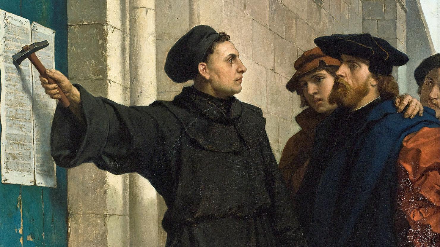 Martin Luther nailing his theses to the Wittenberg church door