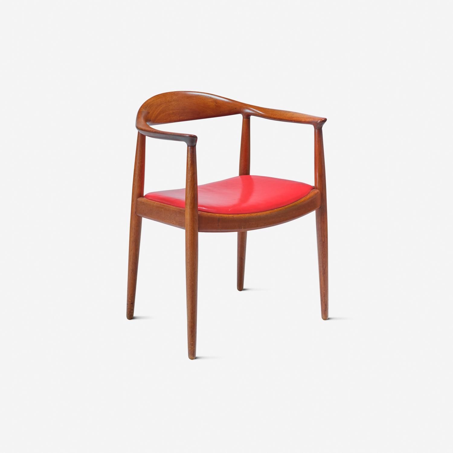 Hans Wegner's Round Chair, 1949, in teak with a red leather seat